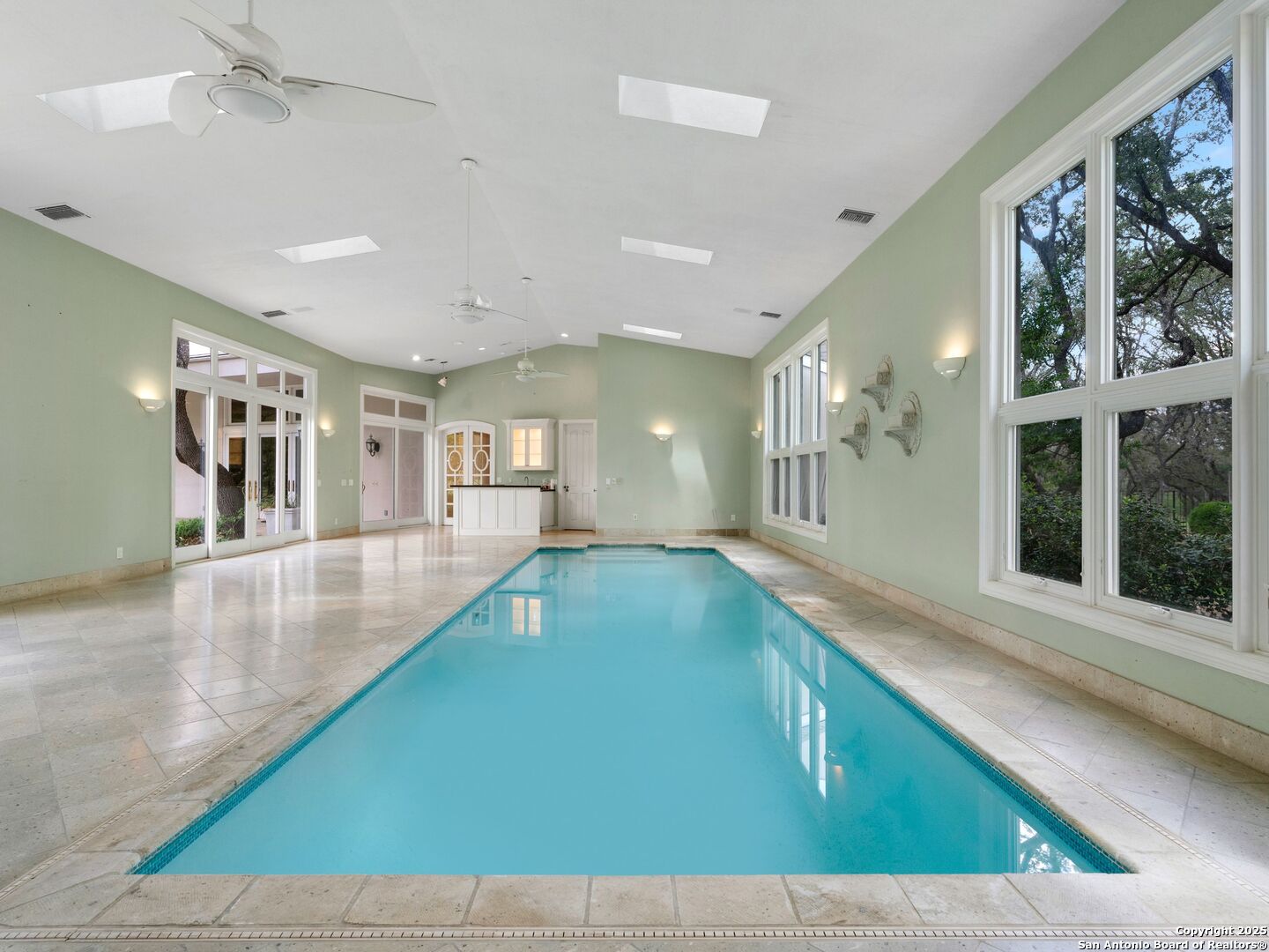 100 Tomahawk Trail Hill Country Village, TX 78232 - Photo 34 of 56 a view of a living room and kitchen with a large window