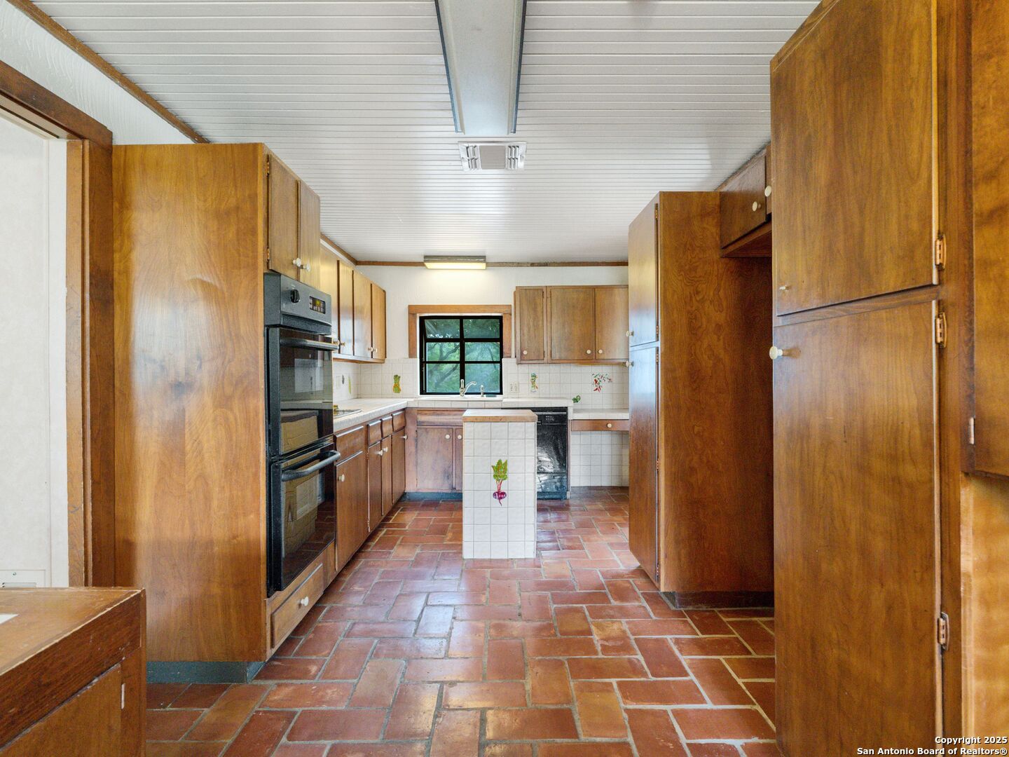 100 Tomahawk Trail Hill Country Village, TX 78232 - Photo 41 of 56 a kitchen with stainless steel appliances granite countertop a refrigerator and a stove