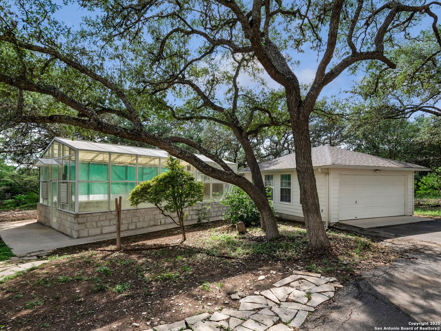100 Tomahawk Trail Hill Country Village, TX 78232 - Photo 48 of 56 a view of a yard with a tree