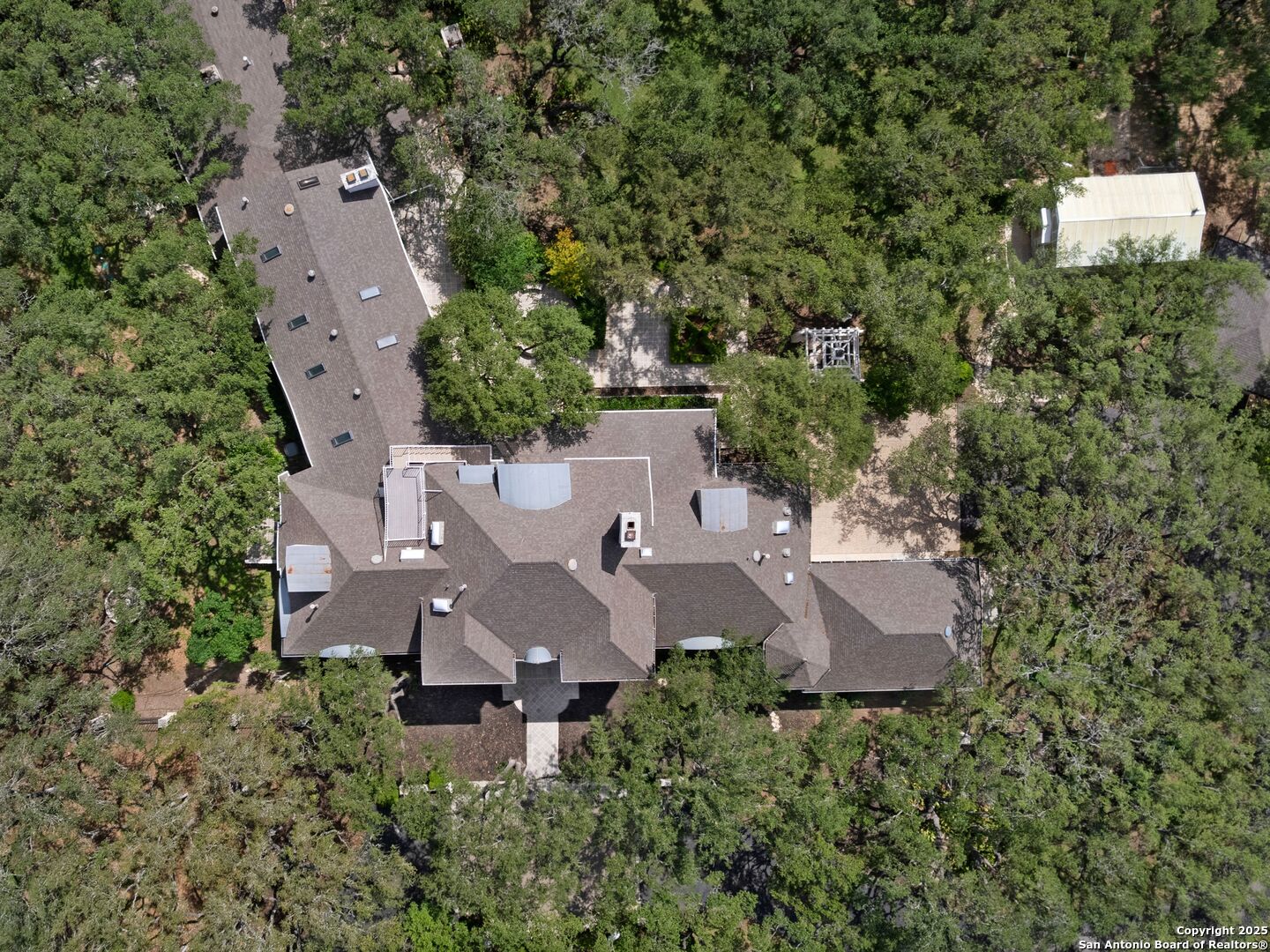 100 Tomahawk Trail Hill Country Village, TX 78232 - Photo 56 of 56 an aerial view of a house with outdoor space and street view
