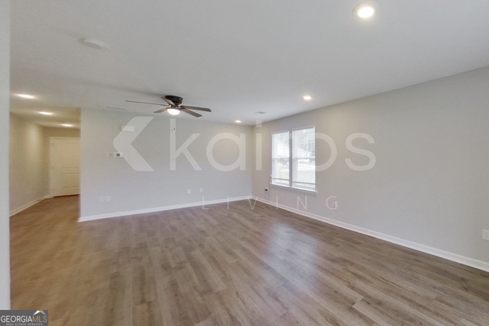 122 Cottage Grove Road Brunswick, GA 31525 - Photo 9 of 20 wooden floor in an empty room with a window