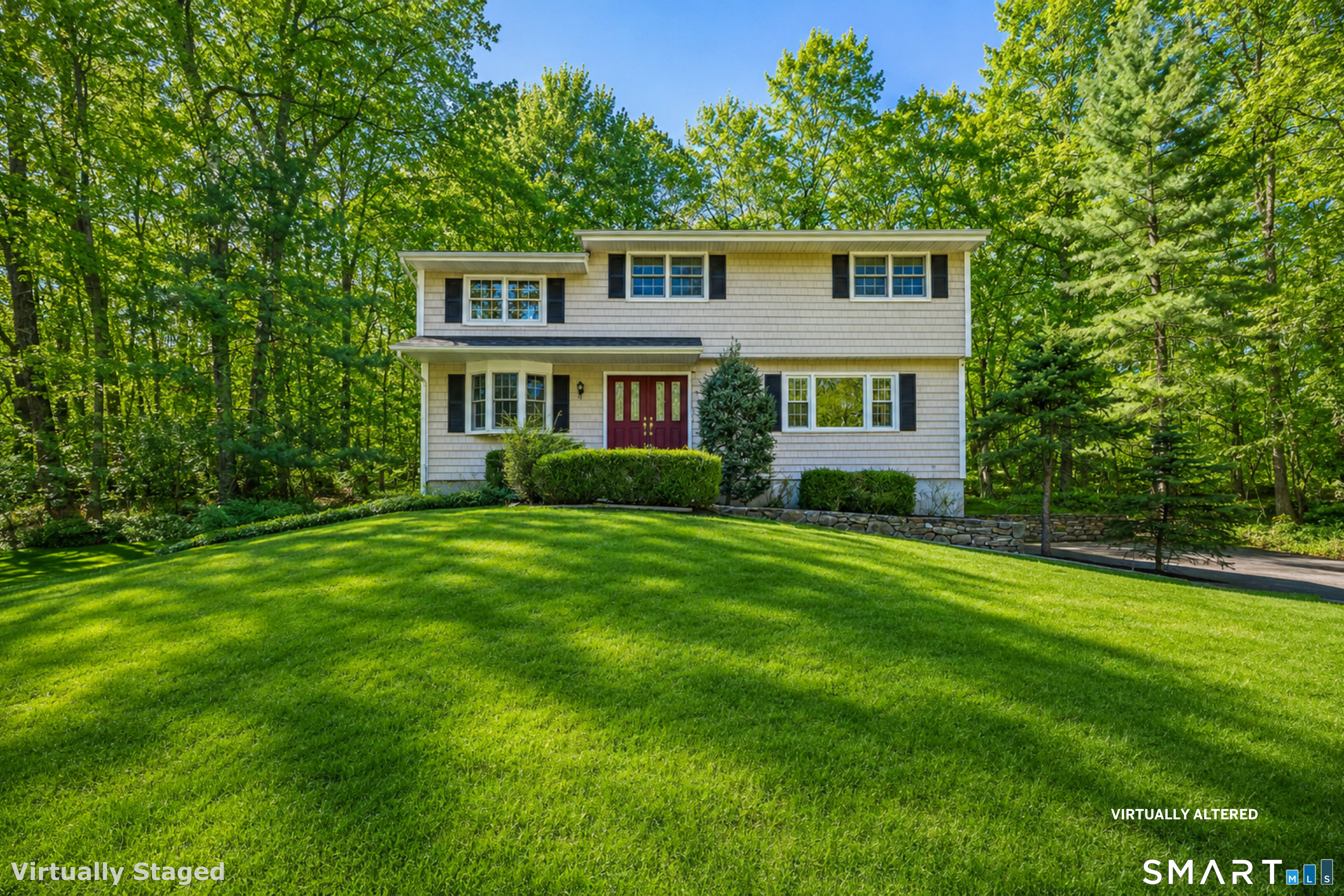 145 Wilton Road East Ridgefield, CT 06877 - Photo 2 of 35 a front view of house with yard and green space