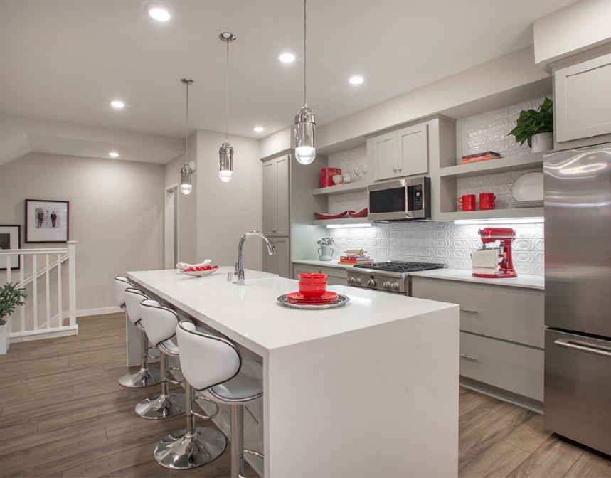 1778 Railway Circle Oakland, CA 94607 - Photo 4 of 6 a kitchen that has a lot of white cabinets and wooden floor