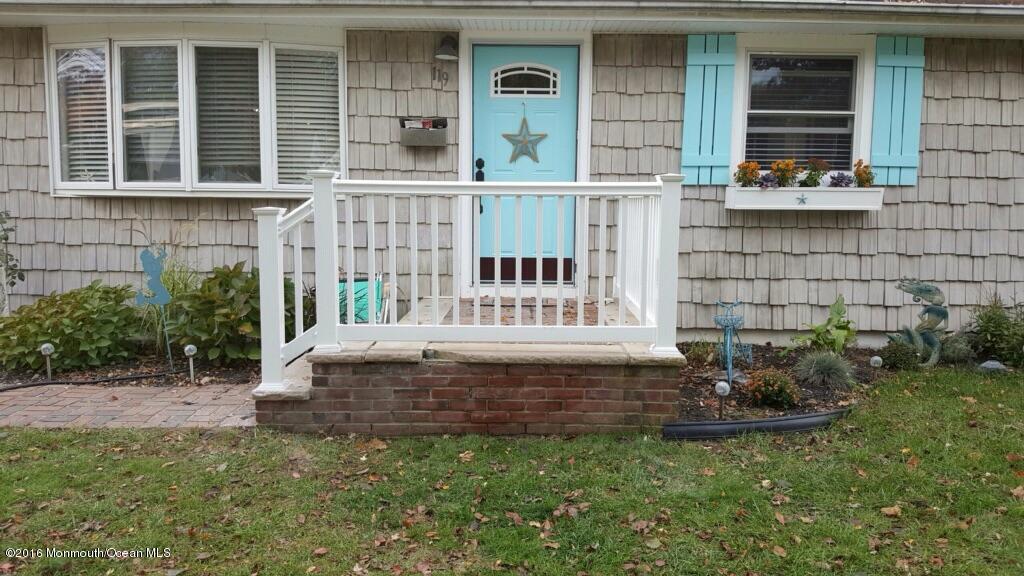 119 Meadowbrook Road Spring Lake Heights, NJ 07762 - Photo 17 of 24 a view of a house with a small yard and a large window
