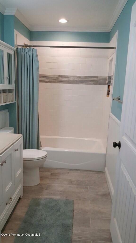 119 Meadowbrook Road Spring Lake Heights, NJ 07762 - Photo 9 of 24 a bathroom with a toilet and a shower
