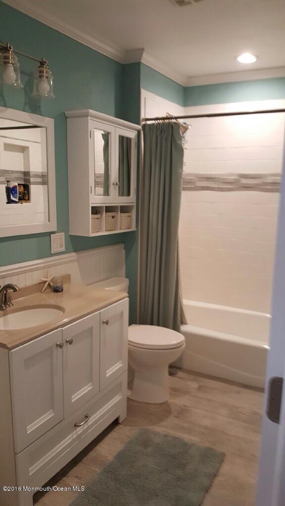119 Meadowbrook Road Spring Lake Heights, NJ 07762 - Photo 10 of 24 a bathroom with a sink toilet and shower