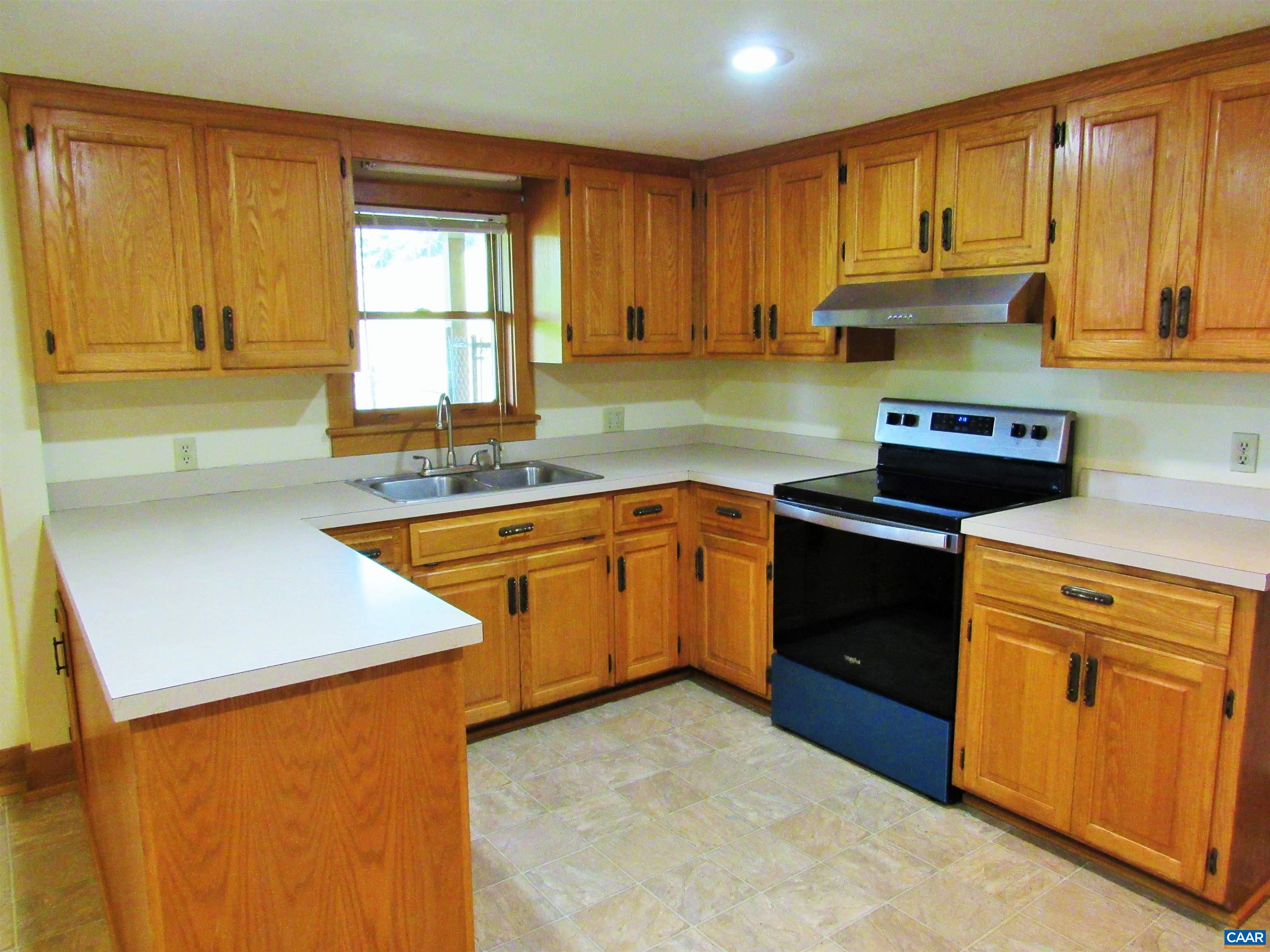 611 Hartless Road Amherst, VA 24521 - Photo 12 of 51 a kitchen with stainless steel appliances granite countertop a sink stove and refrigerator