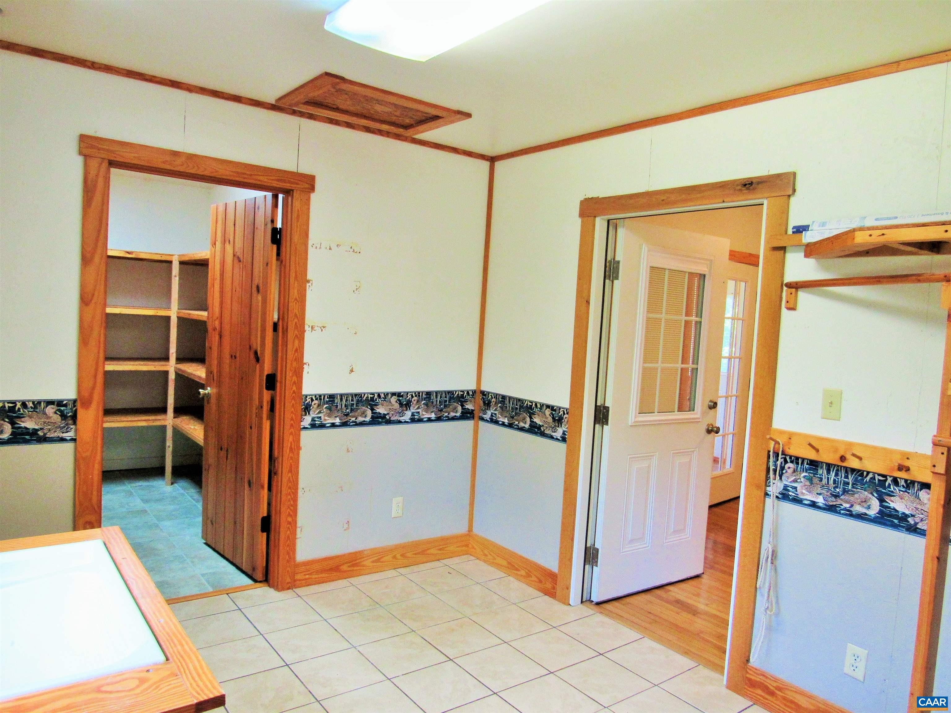 611 Hartless Road Amherst, VA 24521 - Photo 21 of 51 a view of a hallway with closet and a fireplace