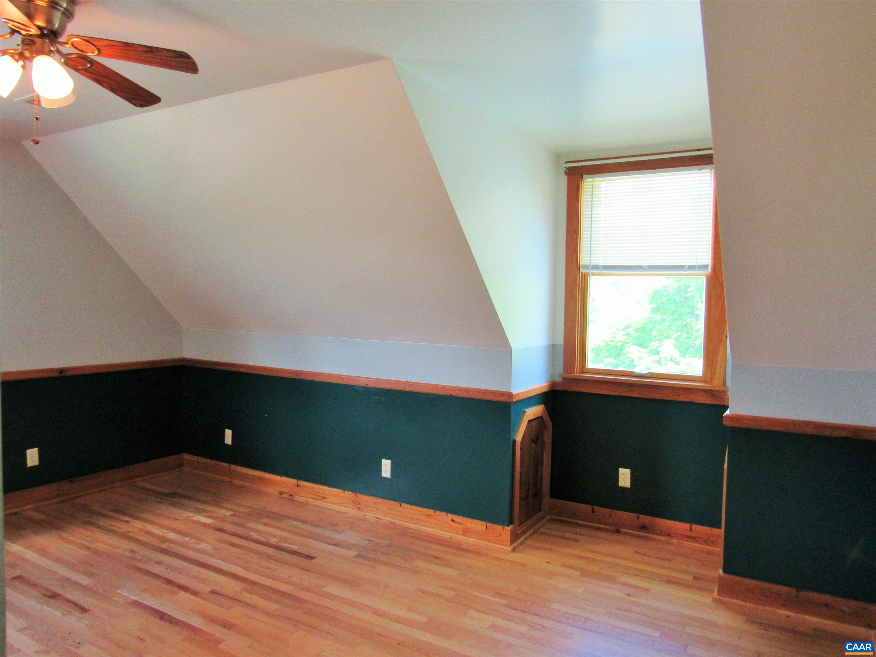 611 Hartless Road Amherst, VA 24521 - Photo 32 of 51 a view of an empty room with wooden floor and a window