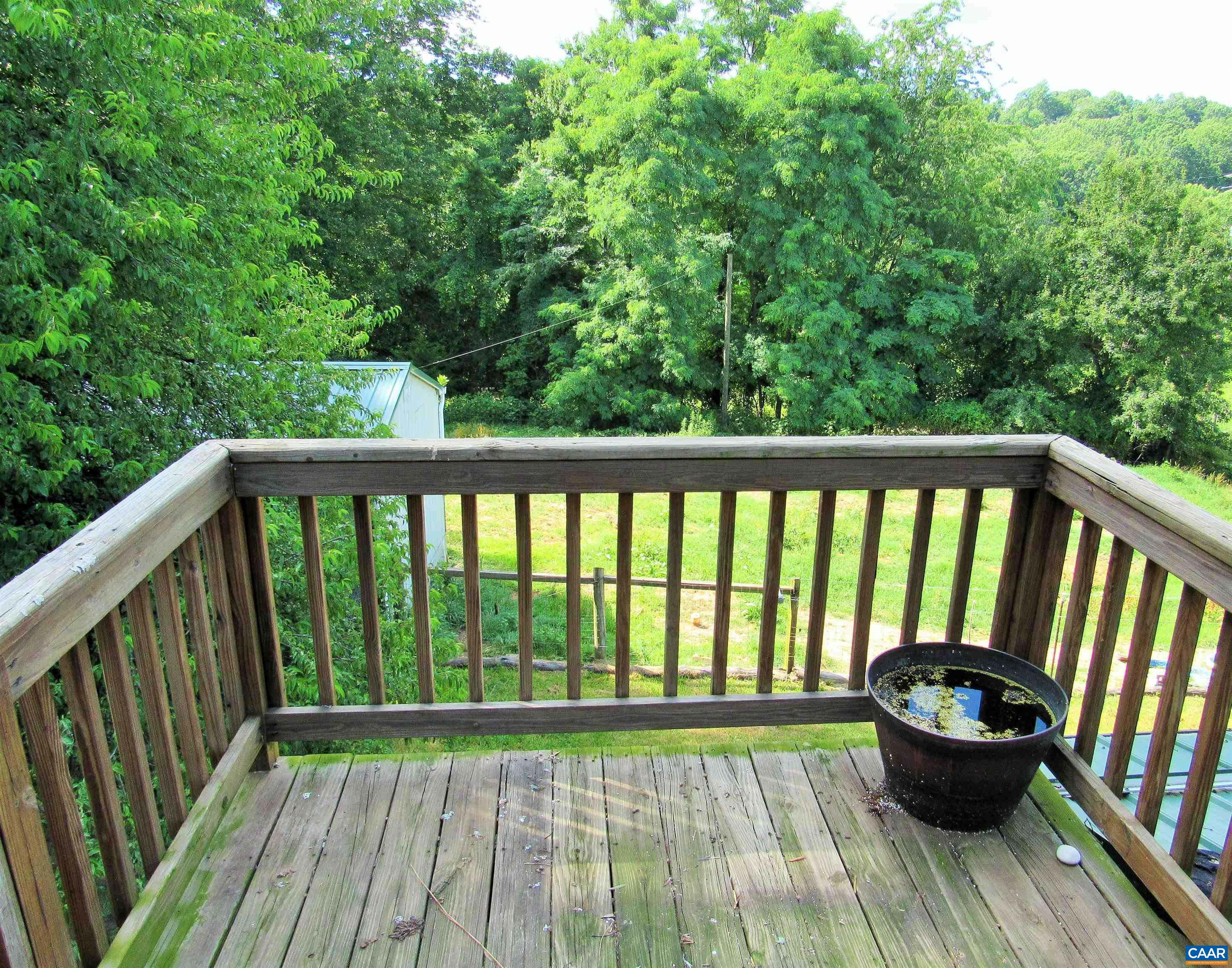 611 Hartless Road Amherst, VA 24521 - Photo 36 of 51 a balcony with wooden floor and large trees