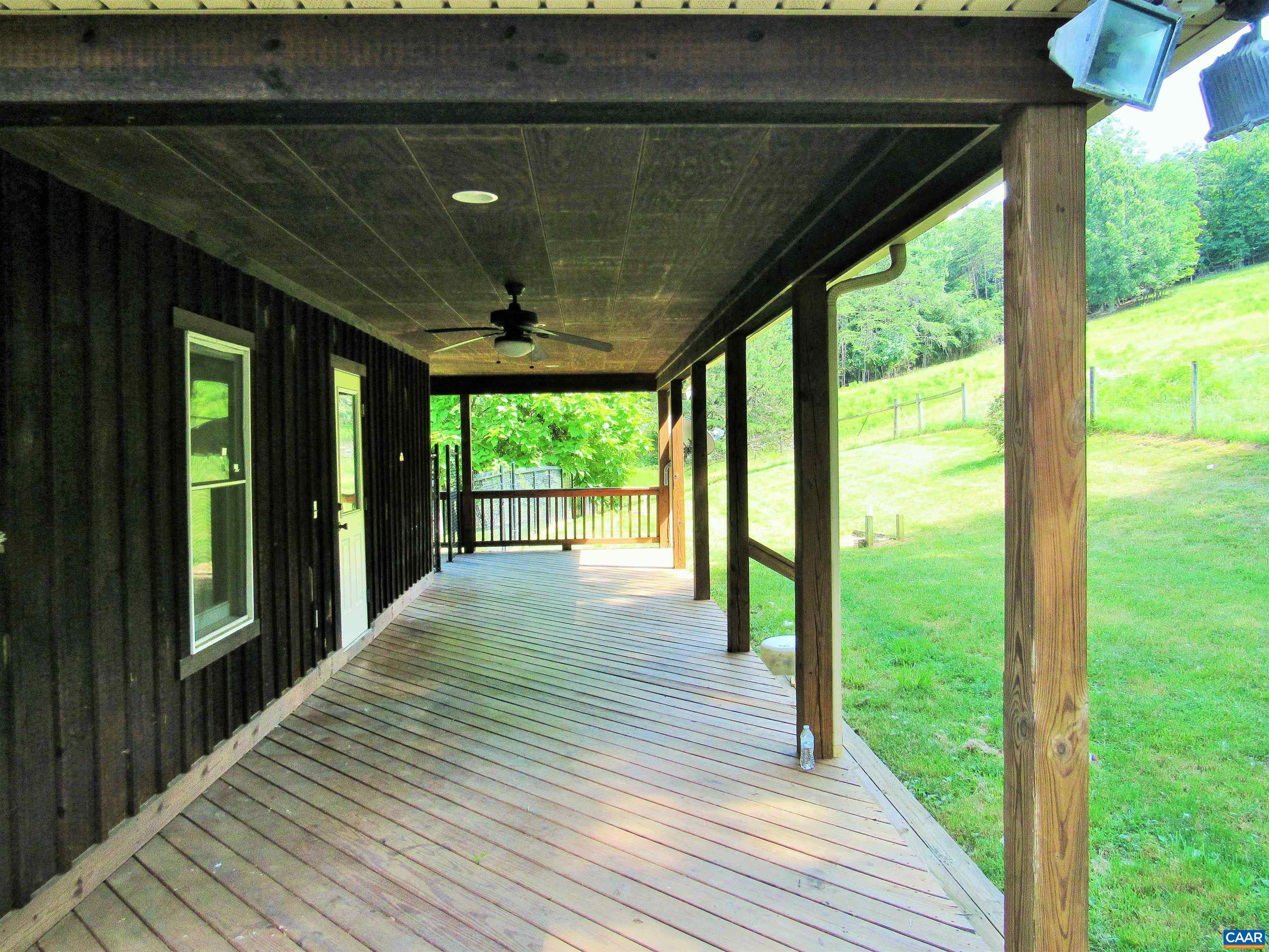 611 Hartless Road Amherst, VA 24521 - Photo 39 of 51 a porch with wooden floor outdoor seating and yard