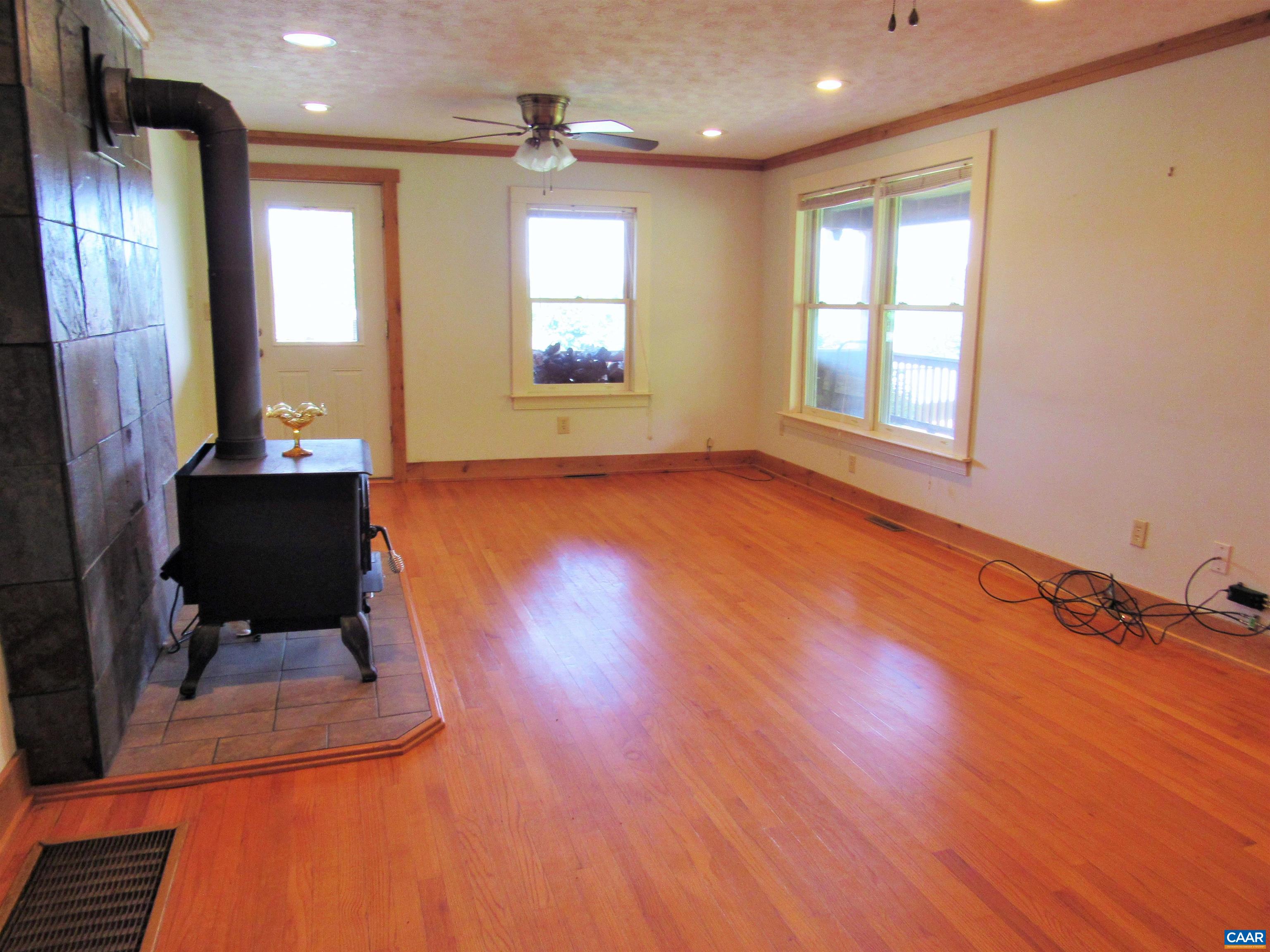 611 Hartless Road Amherst, VA 24521 - Photo 8 of 51 a view of a room with wooden floor and staircase
