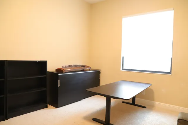 a living room with furniture and a white door