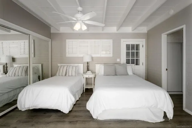 a bedroom with double bed and a large window