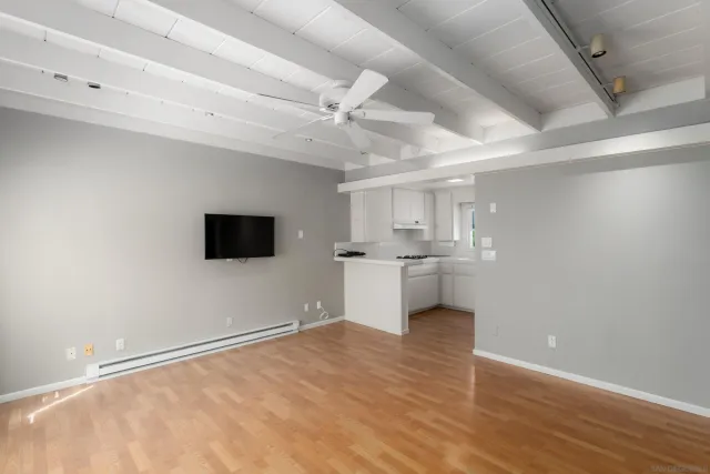 a view of a kitchen with a sink and a microwave