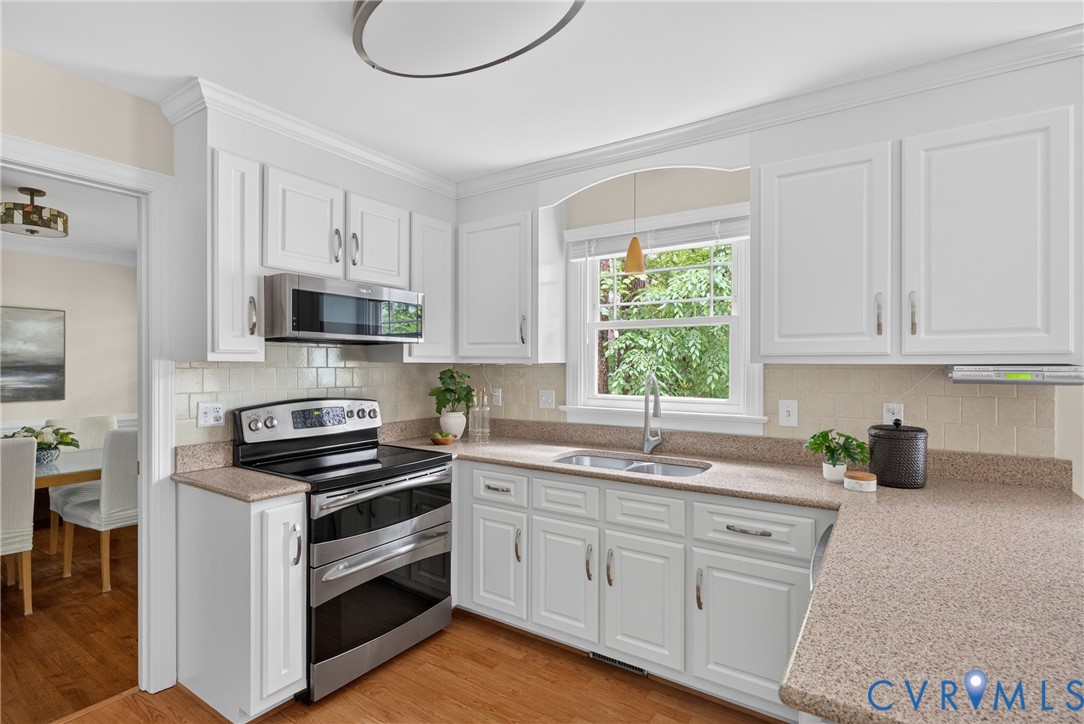 5710 Oak Knoll Road Midlothian, VA 23112 - Photo 17 of 66 The updated Kitchen includes quartz counters, newe