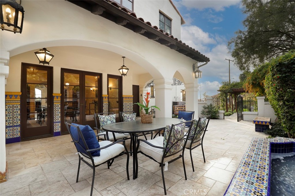 5818 Painter Avenue Whittier, CA 90601 - Photo 8 of 53 a view of a patio with a table and chairs and potted plants
