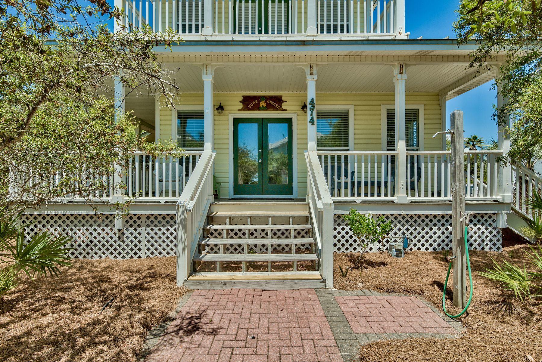 474 Old Beach Road Santa Rosa Beach, FL 32459 - Photo 2 of 24 a view of a wooden house with a bench and wooden fence
