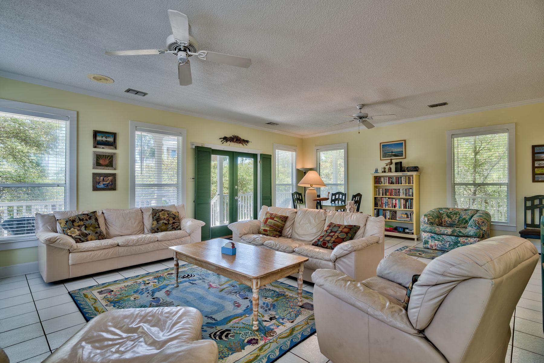 474 Old Beach Road Santa Rosa Beach, FL 32459 - Photo 5 of 24 a living room with furniture ceiling fan and a window