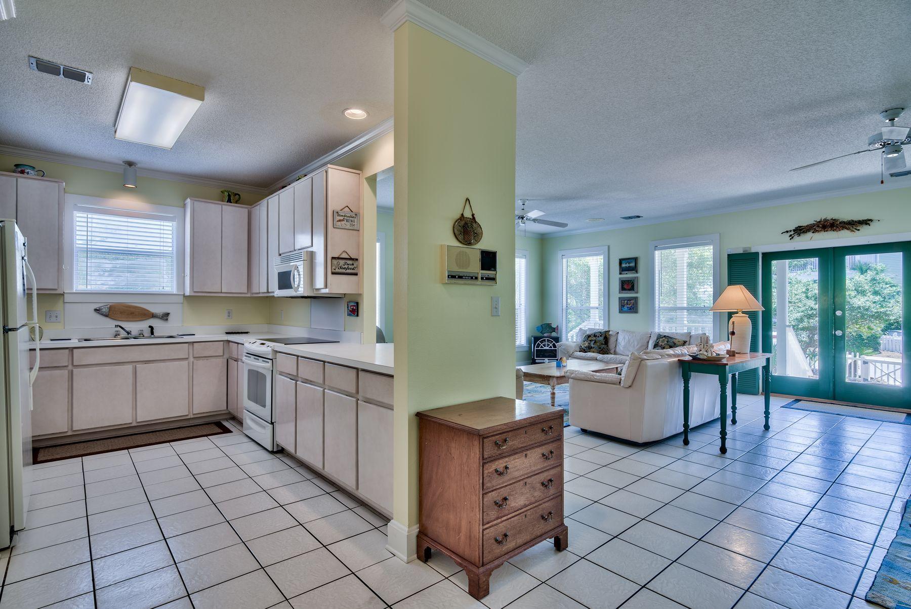 474 Old Beach Road Santa Rosa Beach, FL 32459 - Photo 6 of 24 a kitchen with sink cabinets and window