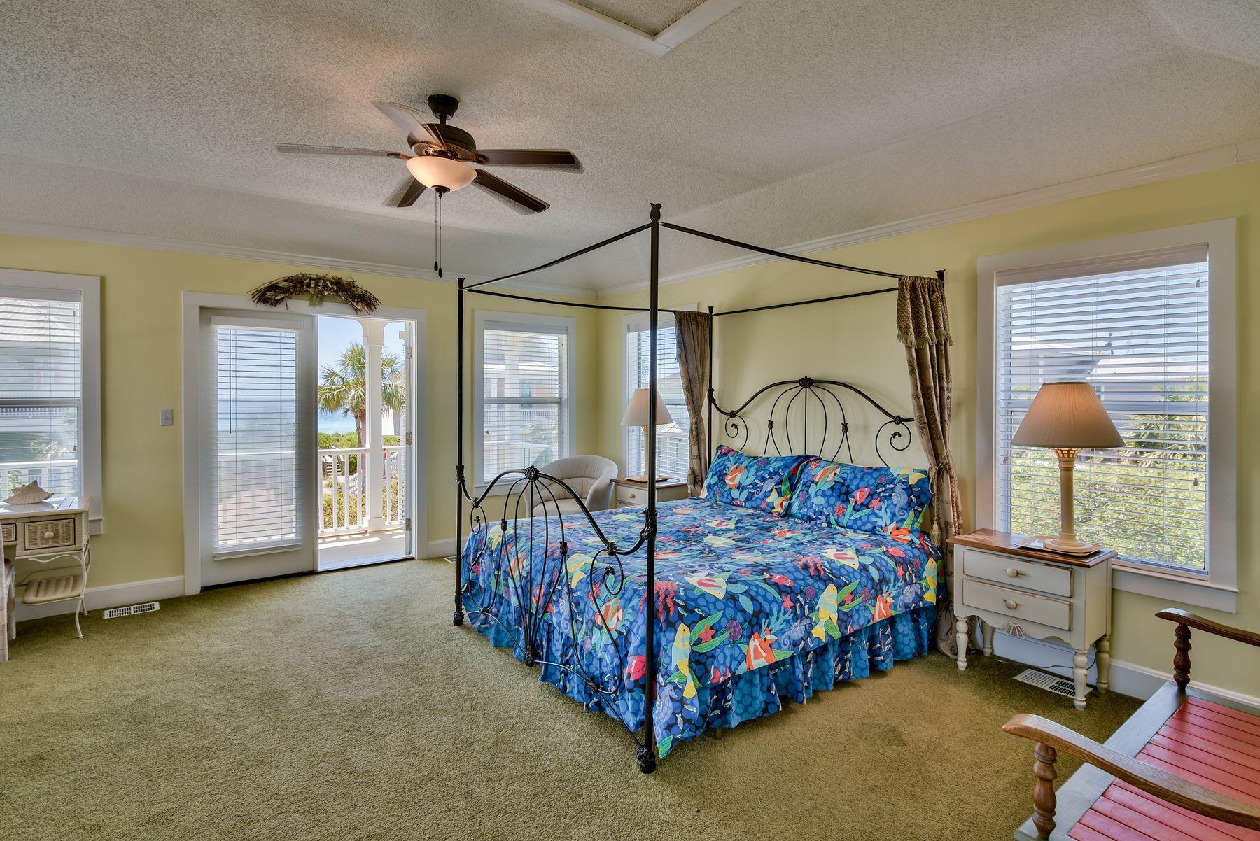 474 Old Beach Road Santa Rosa Beach, FL 32459 - Photo 7 of 24 a bedroom with a bed a window and a chandelier