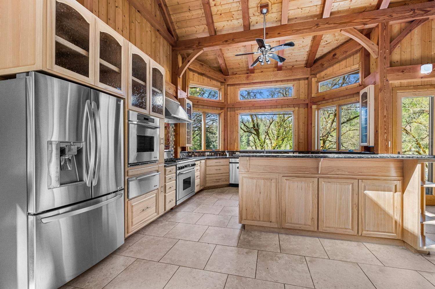 4271 Marshall Road Georgetown, CA 95634 - Photo 12 of 70 a kitchen with stainless steel appliances granite countertop a refrigerator and a sink
