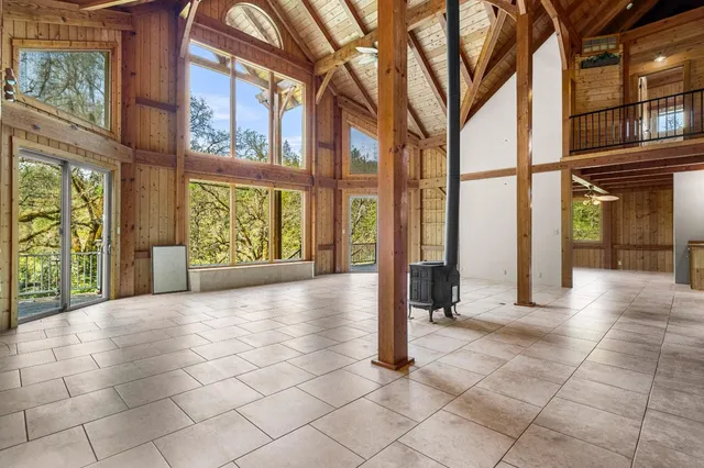 a view of empty room with floor to ceiling window and outdoor space