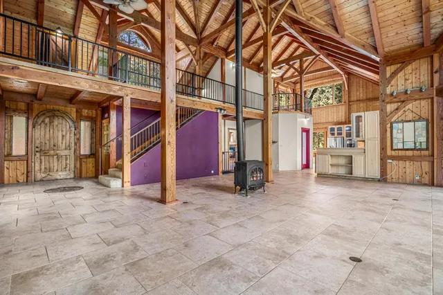 a bathroom with a granite countertop sink and a large mirror