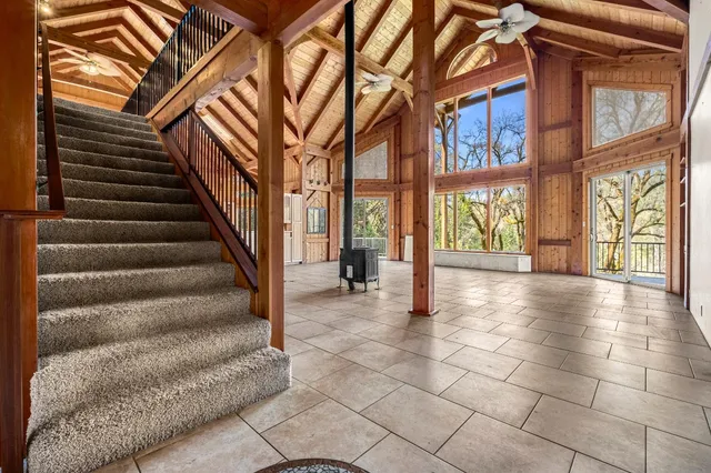 a view of a house with a snow in the yard