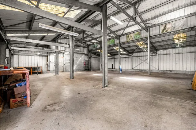 a view of an empty room with fire place and a fireplace