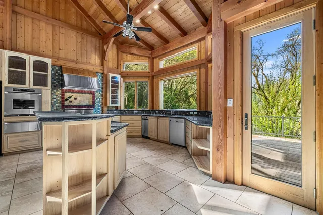 a bathroom with a sink a bathtub and next to a window