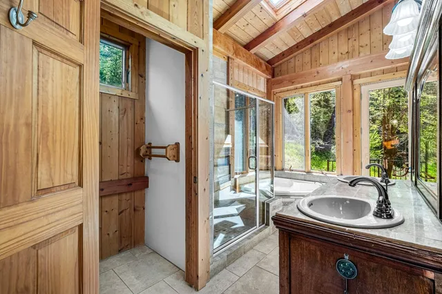 a bathroom with a sink toilet and shower