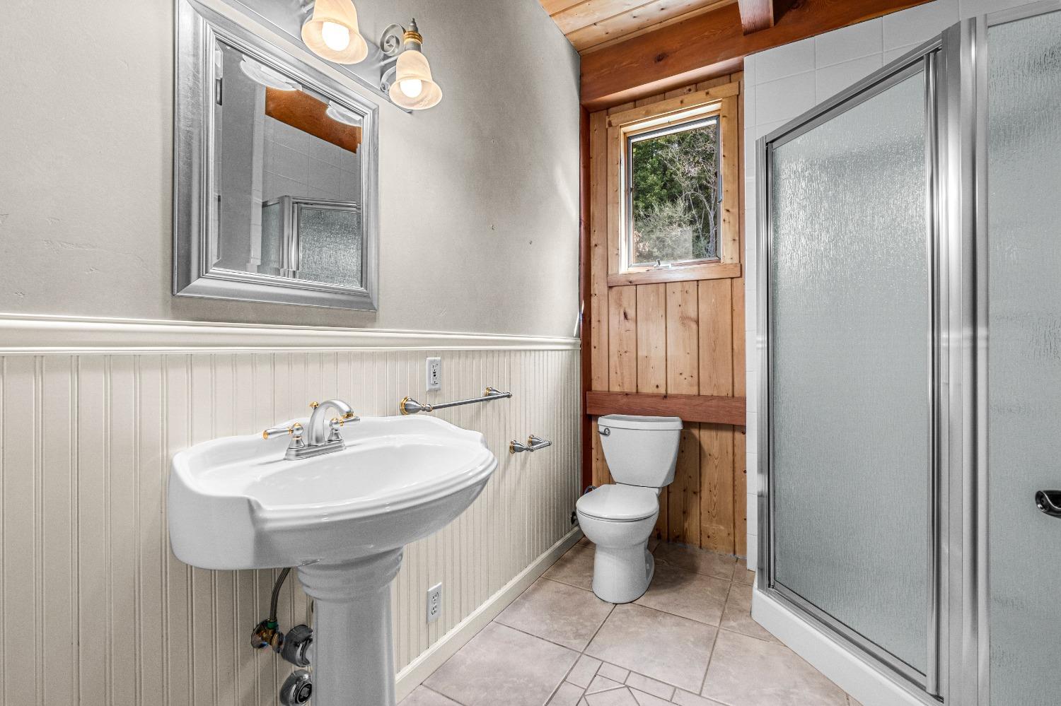 4271 Marshall Road Georgetown, CA 95634 - Photo 45 of 70 a bathroom with a sink toilet and mirror