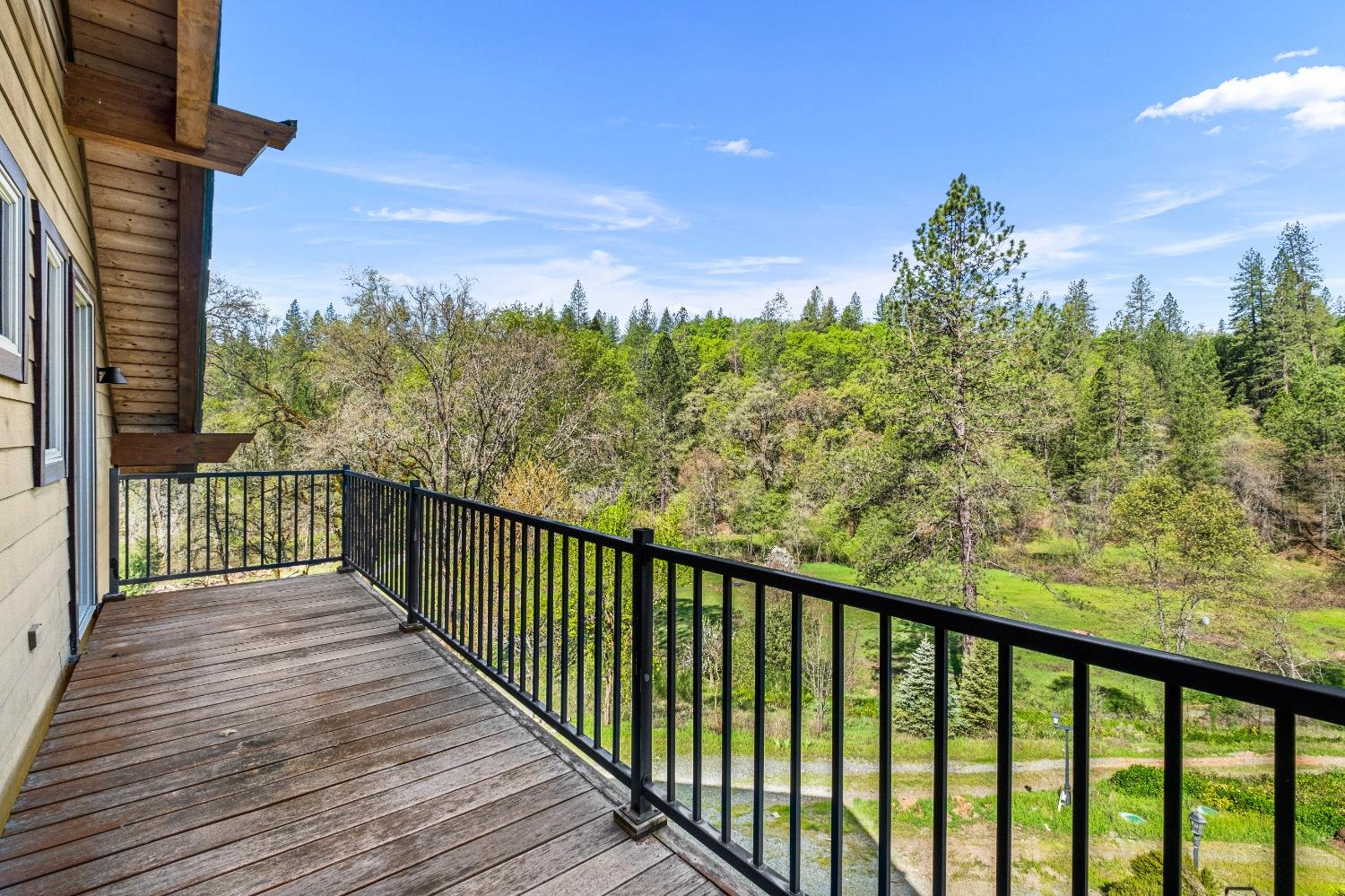 4271 Marshall Road Georgetown, CA 95634 - Photo 49 of 70 a view of a balcony with wooden floor and fence