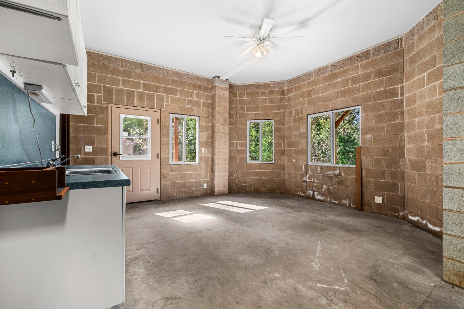 4271 Marshall Road Georgetown, CA 95634 - Photo 50 of 70 a view of a livingroom with furniture a ceiling fan and window