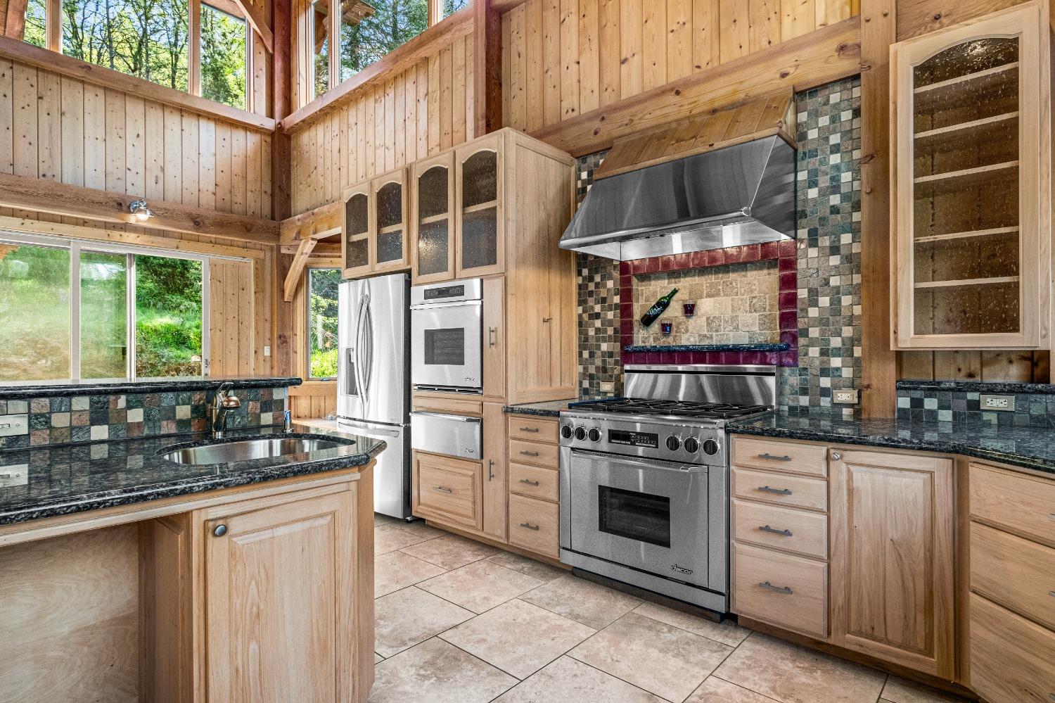 4271 Marshall Road Georgetown, CA 95634 - Photo 6 of 70 a kitchen with stainless steel appliances a stove and a sink