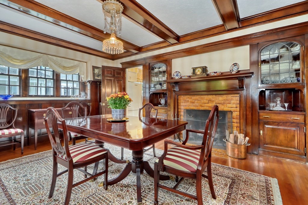 3 Sheffield Road Winchester, MA 01890 - Photo 13 of 42 a dining room with furniture a fireplace and wooden floor