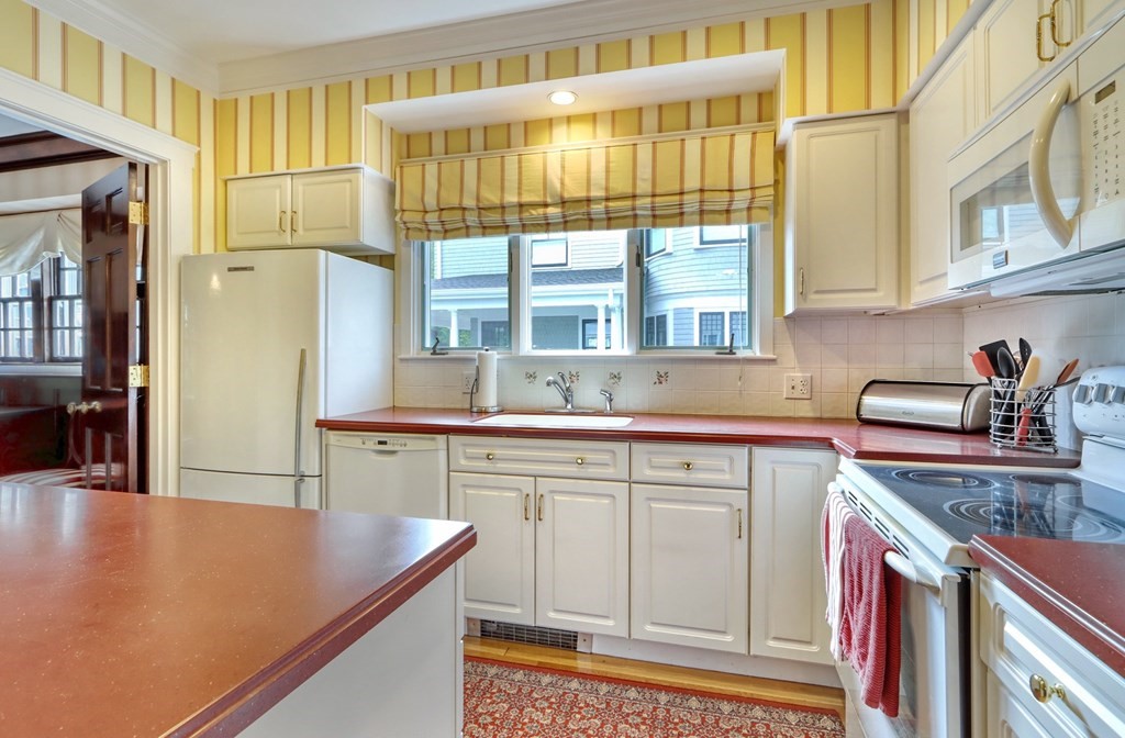 3 Sheffield Road Winchester, MA 01890 - Photo 16 of 42 a kitchen with stainless steel appliances granite countertop a sink and a cabinets