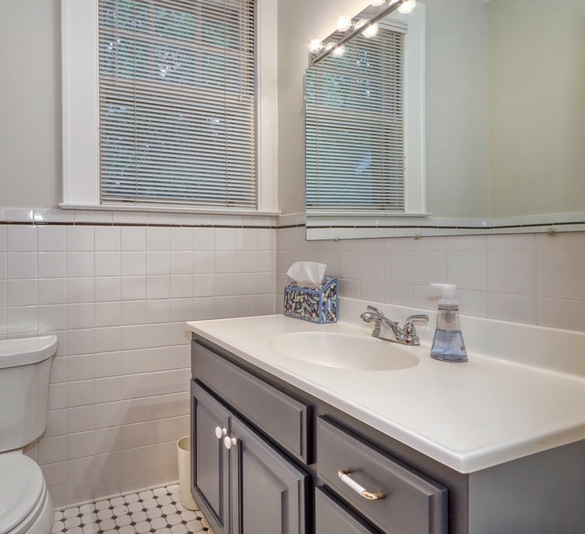 3 Sheffield Road Winchester, MA 01890 - Photo 19 of 42 a bathroom with a sink cabinets and a toilet