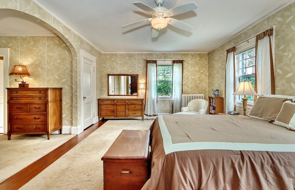 3 Sheffield Road Winchester, MA 01890 - Photo 24 of 42 a bedroom with a bed and wooden floor