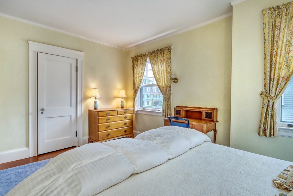 3 Sheffield Road Winchester, MA 01890 - Photo 32 of 42 a bedroom with a bed and wooden floor