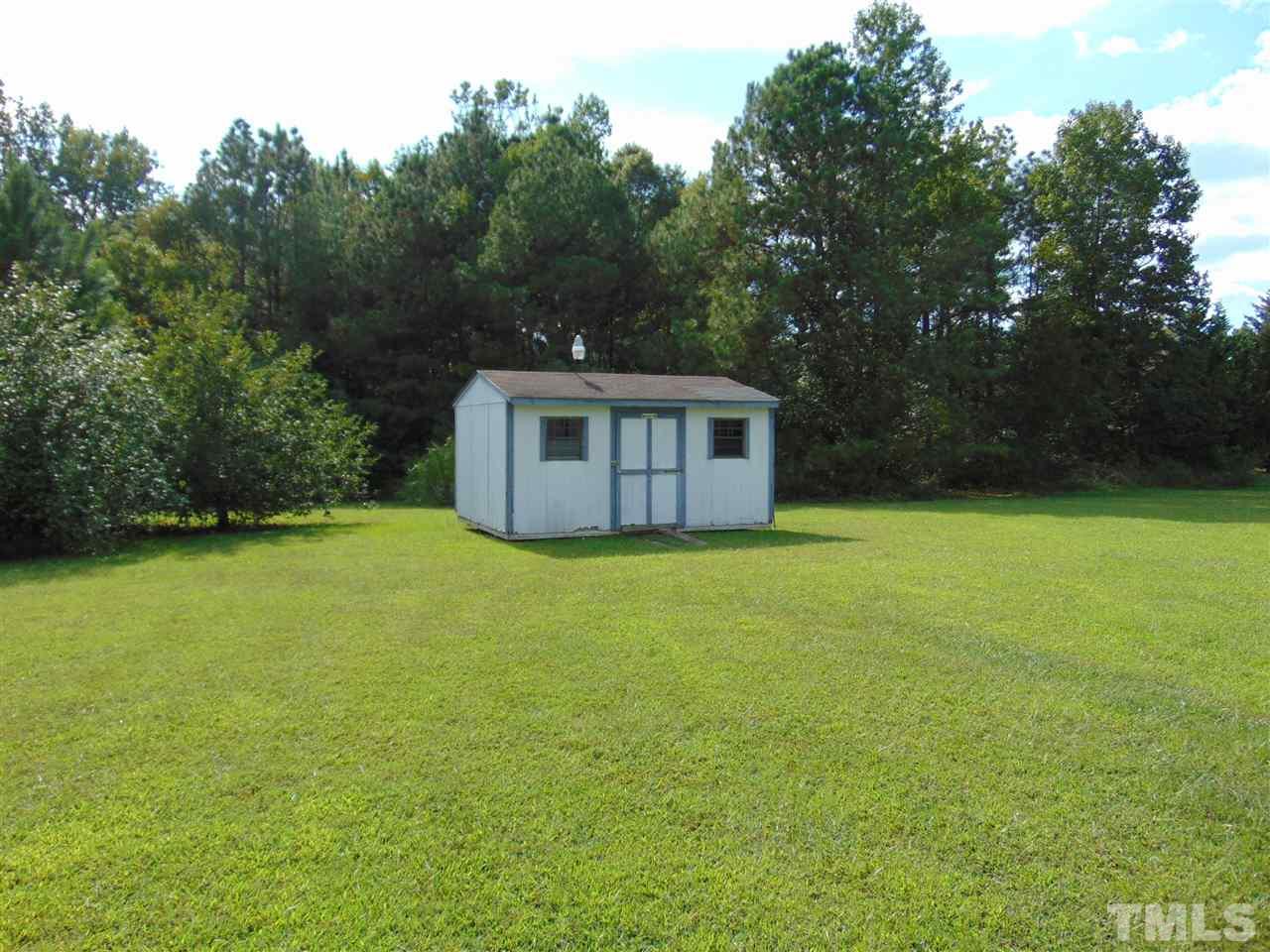 1611 Gate 2 Road Creedmoor, NC 27522 - Photo 3 of 3 a view of a house with backyard and garden