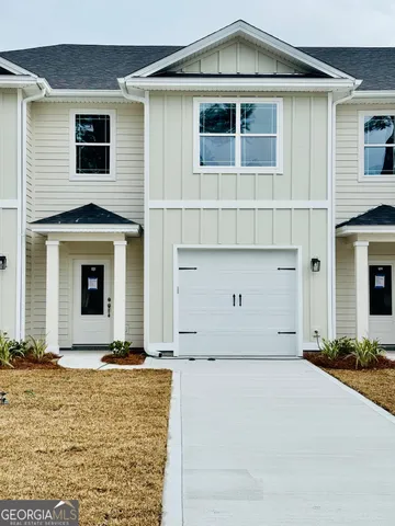 a front view of a house with many windows