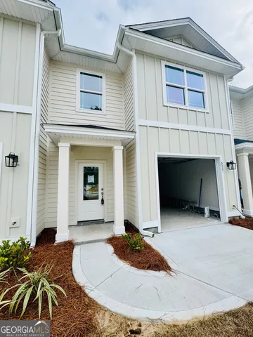 a front view of a house with yard