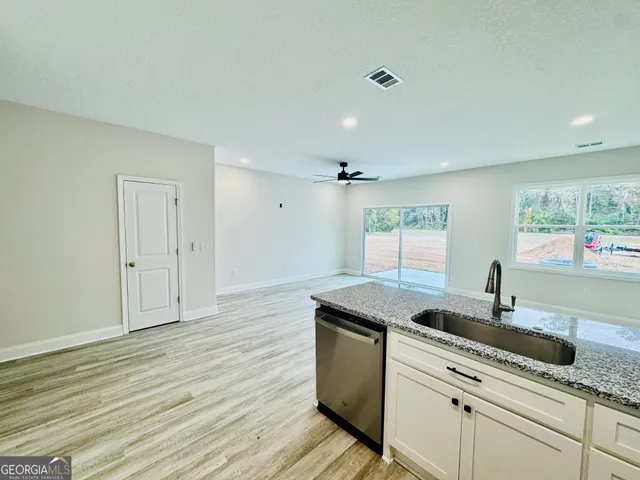 a kitchen with a sink and cabinets