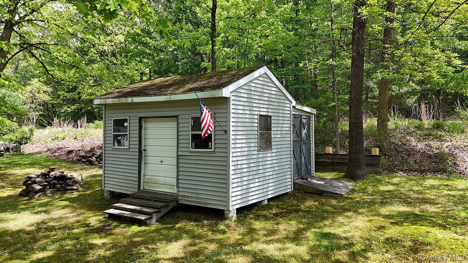 860 River Road Callicoon, NY 12723 - Photo 33 of 45 a view of a small house with a yard