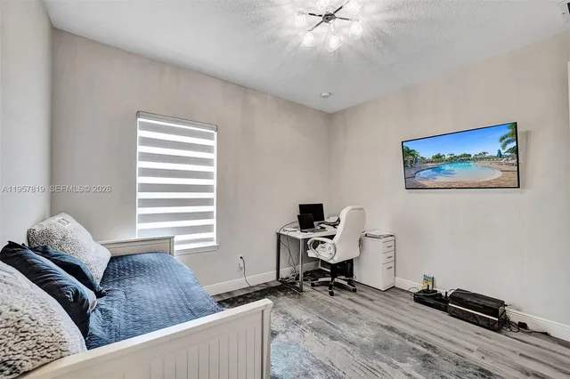 a living room with a couch and a window