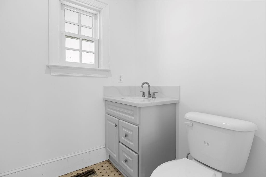 312 East 3rd Street Rome, GA 30161 - Photo 24 of 42 a bathroom with a toilet sink and mirror