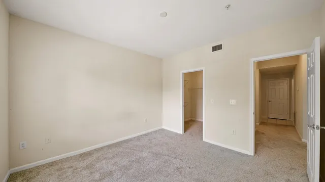 an empty room with closet area