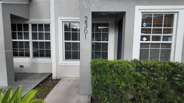 a view of front door and a window